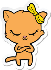 sticker of a cute cartoon cat with bow