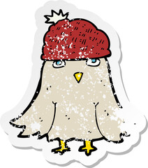 retro distressed sticker of a cartoon owl wearing hat