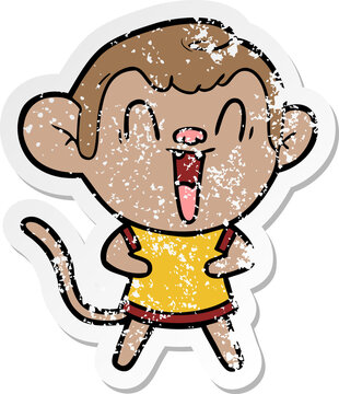 distressed sticker of a cartoon laughing monkey