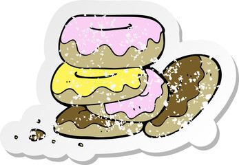 retro distressed sticker of a cartoon pile of donuts