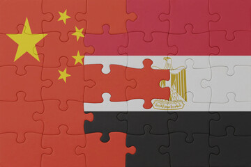 puzzle with the national flag of egypt and china . macro.concept.