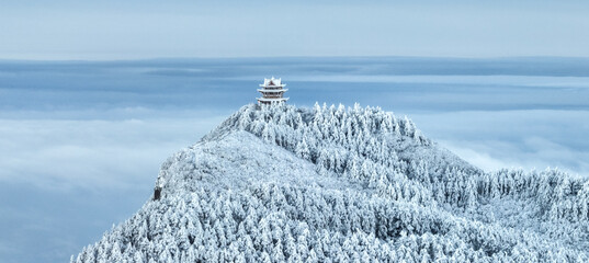 Aerial photography of snow covered Mount Emei in winter, the golden summit of Mount Emei in Sichuan(Huazang Temple), a famous Buddhist mountain in China