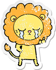 distressed sticker of a crying cartoon lion