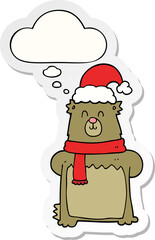 cartoon bear wearing christmas hat with thought bubble as a printed sticker