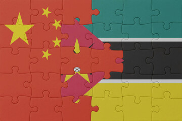 puzzle with the national flag of mozambique and china . macro.concept.