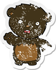 retro distressed sticker of a cartoon worried black bear