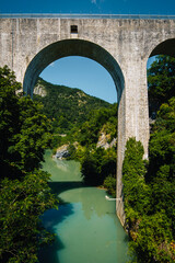 Fototapeta na wymiar The Saint Nazaire en Royans aqueduct spanning over the Bourne river in the South of France (Drome)