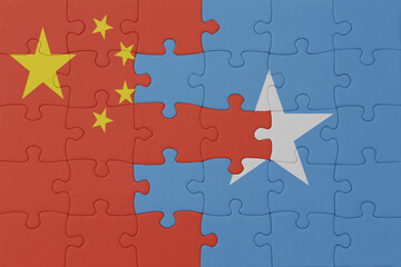 puzzle with the national flag of somalia and china . macro.concept.