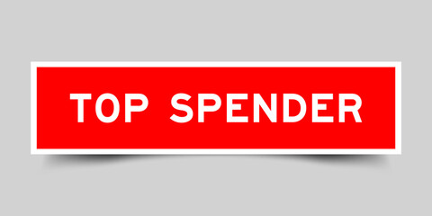 Sticker label with word top spender in red color on gray background