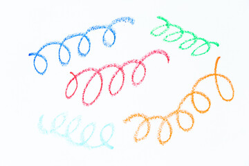 Colorful oil pastel hand drawing in curve or wavy line shape on white paper background