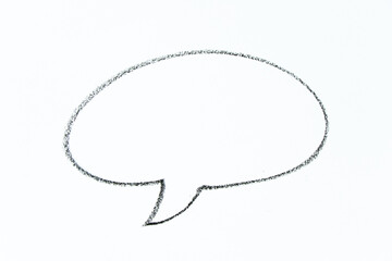 black color oil pastel hand drawing in round speech banner shape on white paper background with copy space