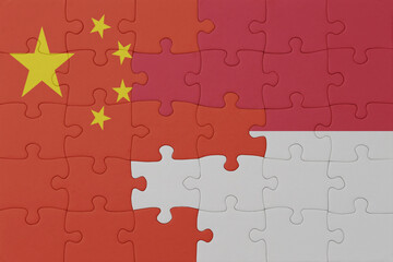 puzzle with the national flag of indonesia and china . macro.concept.