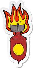 sticker of a cartoon burning bomb