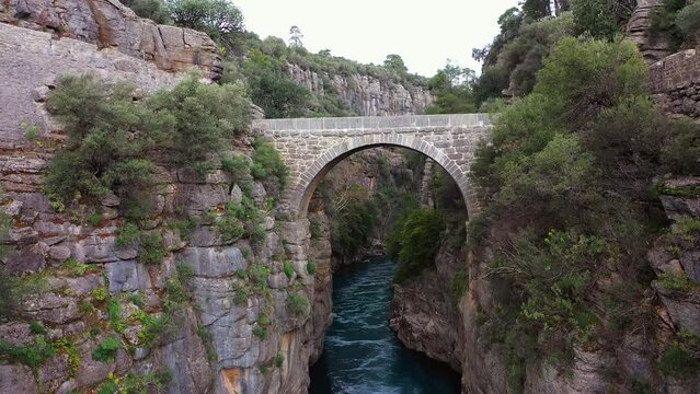 Oluk stone bridge in Koprulu canyon over Köprüçay river, drone video, Manavgat, Antalya, Turkey