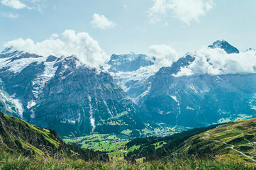 Fototapeta na wymiar Summer mountain landscape with green grass and mountain peaks.