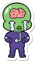 sticker of a cartoon big brain alien crying