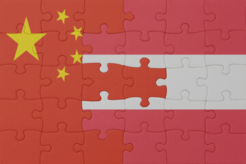 puzzle with the national flag of austria and china . macro.concept.