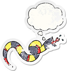 cartoon hissing snake with thought bubble as a distressed worn sticker