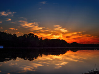 Fototapeta na wymiar Colorful sunset over the river, summer landscape