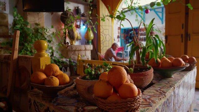 Close up bowls with oranges in the restaurant entrance in Sousse. Traditional african style restaurant in old medina.