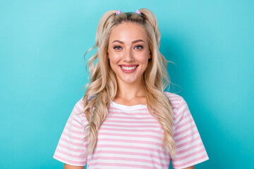 Photo portrait of positive charming lady wavy blonde hair wear pink striped t-shirt enjoy her white teeth smile isolated on cyan color background