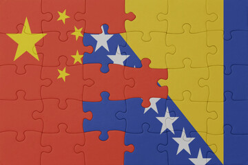 puzzle with the national flag of bosnia and herzegovina and china . macro.concept.