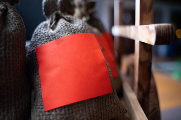 A small sack for storing herbs and spices with red paper on the face