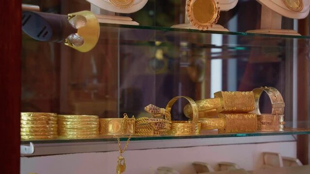 jewelry shop at the market on the medina of Sousse in Tunisia. Traditional golden bracelets for sale.