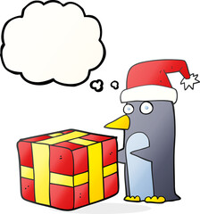 freehand drawn thought bubble cartoon christmas penguin with present