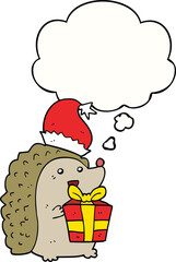 cartoon hedgehog wearing christmas hat with thought bubble