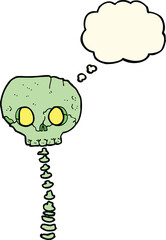 cartoon spooky skull and spine with thought bubble