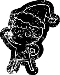 quirky cartoon distressed icon of a grumpy boy wearing santa hat