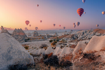 Landscape sunrise in Cappadocia with set colorful hot air balloon fly in sky with sun light....