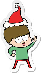 happy hand drawn sticker cartoon of a boy wearing santa hat