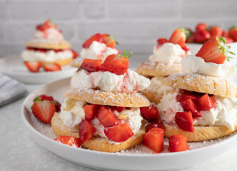 Strawberry shortcakes on a white platter