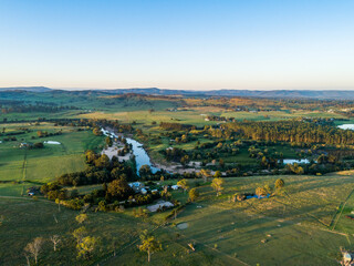 Aerial view of farms in Aberglasslyn over hunter river to Maitland Vale at dusk