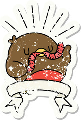 worn old sticker of a tattoo style robin with worm