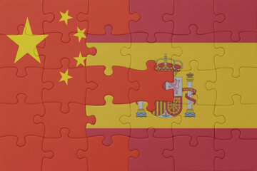 puzzle with the national flag of spain and china . macro.concept.
