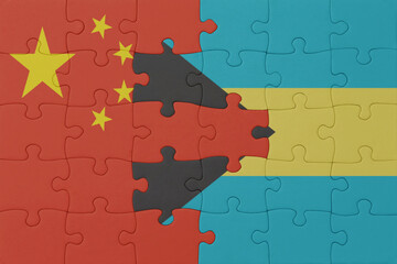 puzzle with the national flag of bahamas and china . macro.concept.