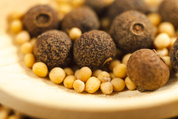 Black pepper with mustard seeds, close-up, macro