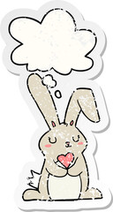 cartoon rabbit in love with thought bubble as a distressed worn sticker