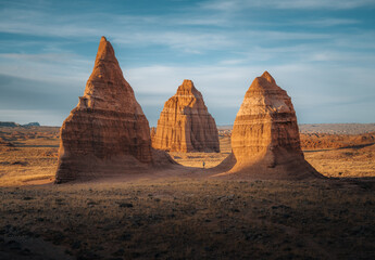 Tourist standing at Temple of the Moon at sunset, Cathedral Valley, Capitol Reef National Park, Utah, Western United States, USA © Mathias