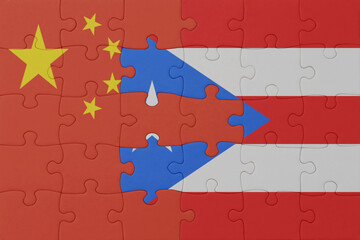 puzzle with the national flag of puerto rico and china . macro.concept.