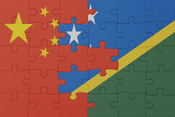 puzzle with the national flag of Solomon Islands and china . macro.concept.