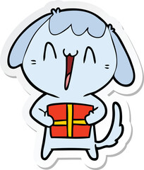 sticker of a cute cartoon dog with christmas present