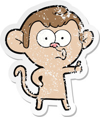 distressed sticker of a cartoon hooting monkey