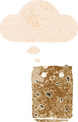 cartoon biscuit with thought bubble in grunge distressed retro textured style