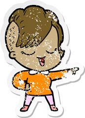 distressed sticker of a happy cartoon girl pointing