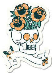 worn old sticker with banner of a skull and roses