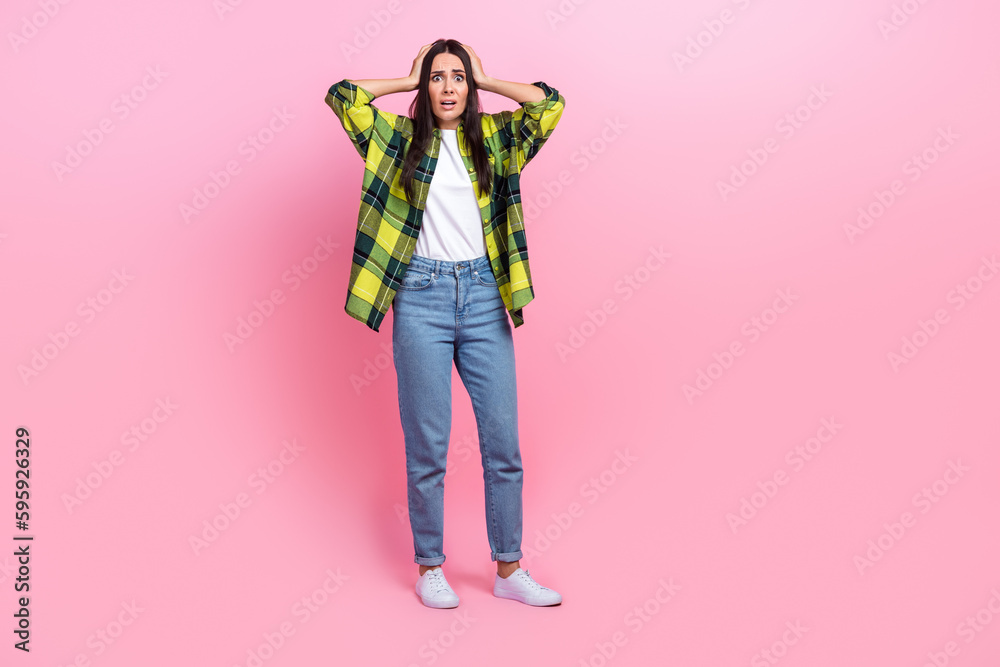 Poster Full length photo of stressed shocked woman dressed plaid shirt arms head empty space isolated pink color background